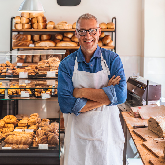 Bakery owner standing in his shop