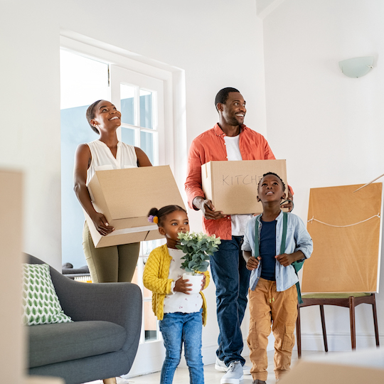 Happy family moving into a new home