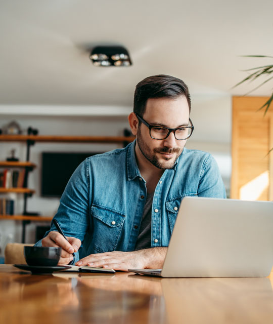 Man working on a laptop at home