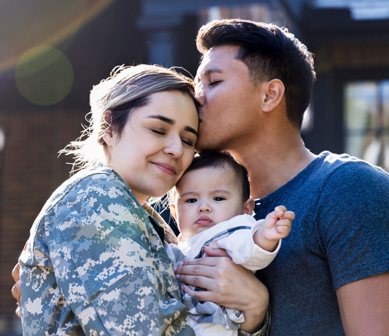 Man, woman, and child standing